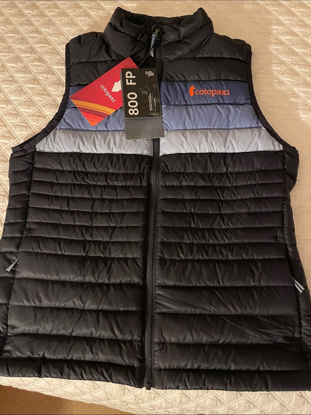 cotopaxi Black vest with blue and light blue colorblock